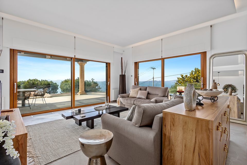 The View House living room opening directly to the terrace and sea
