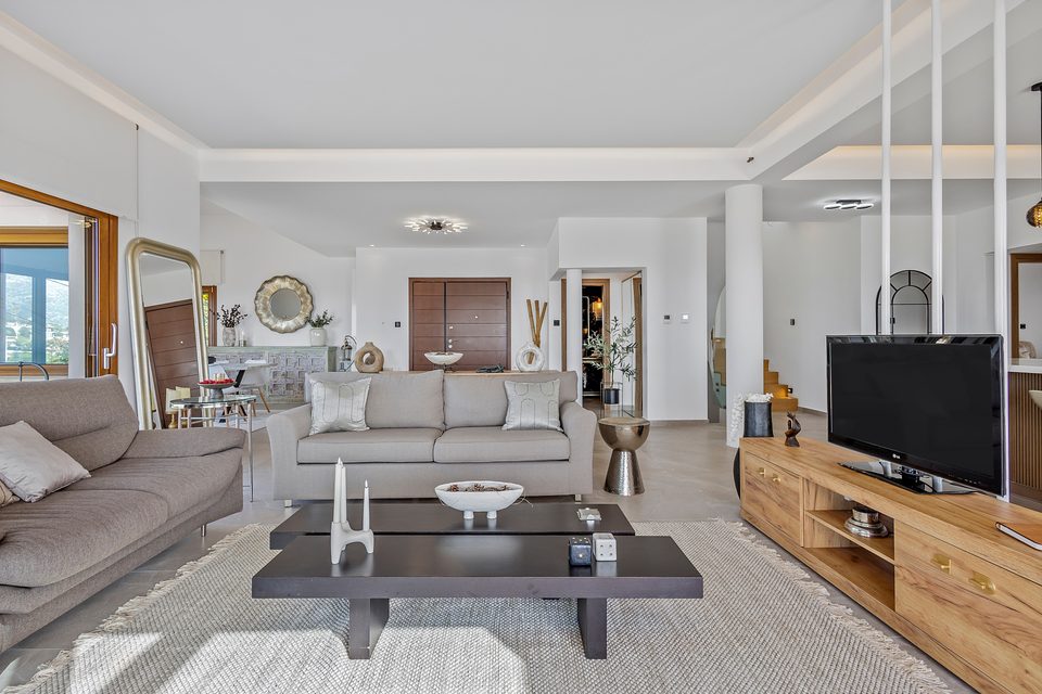 A View House suite with an open ensuite vanity and a sea-view balcony beyond
