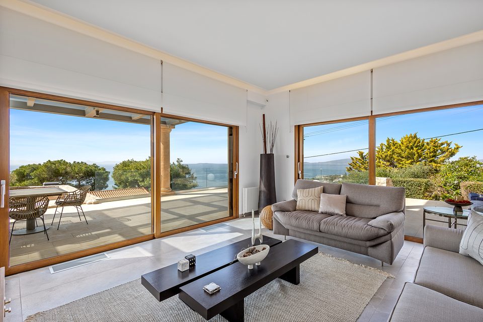 A View House suite with a study corner and balcony opening to the coastline