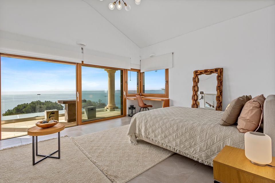 A top-floor View House suite framed by the Saronic Gulf